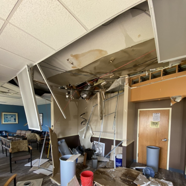 Severe interior water and ceiling damage inside commercial property during restoration