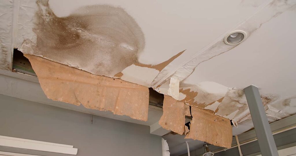 Ceiling drywall collapse caused by water leak and structural damage